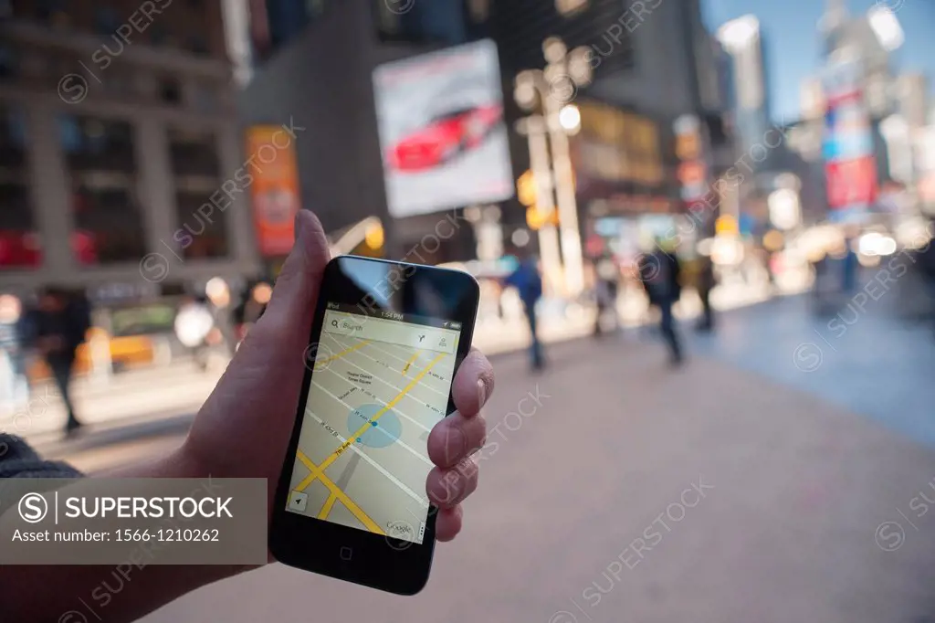 An iPod Touch user displays the Google Maps app on her device in Times Square in New York Google released a version of their successful Map app for Ap...