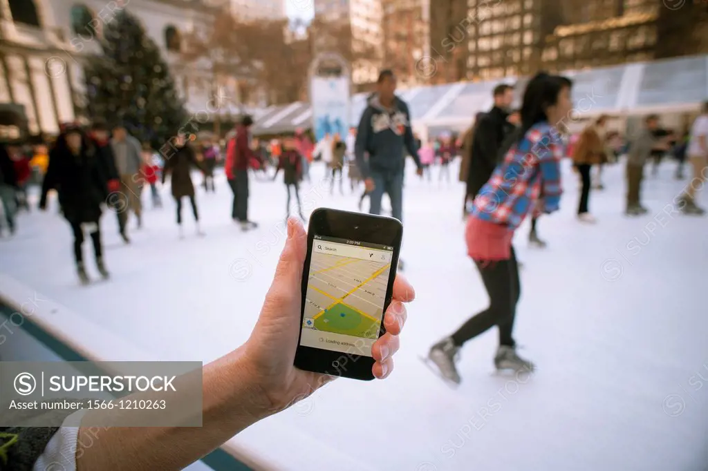 An iPod Touch user displays the Google Maps app on her device in Bryant Park in New York Google released a version of their successful Map app for App...