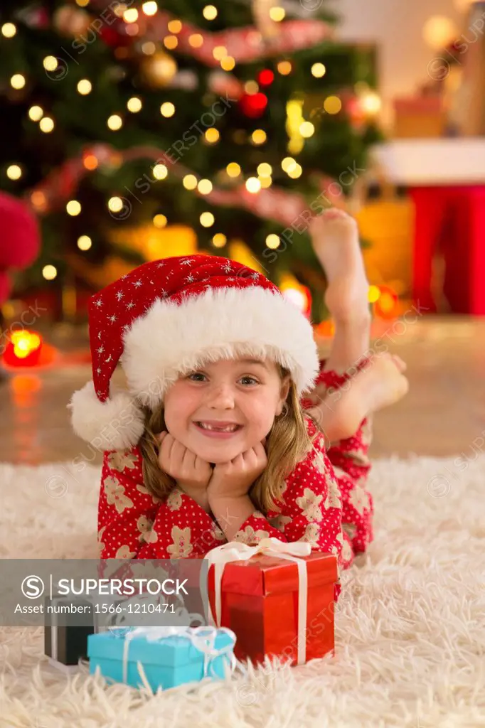 Young girl with gifts at Christmas time