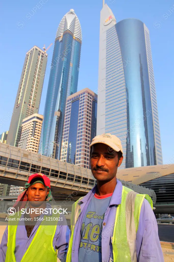 United Arab Emirates, U A E , UAE, Middle East, Dubai, Trade Centre, Sheikh Zayed Road, Asian, man, migrant worker, foreign laborer, job, construction...