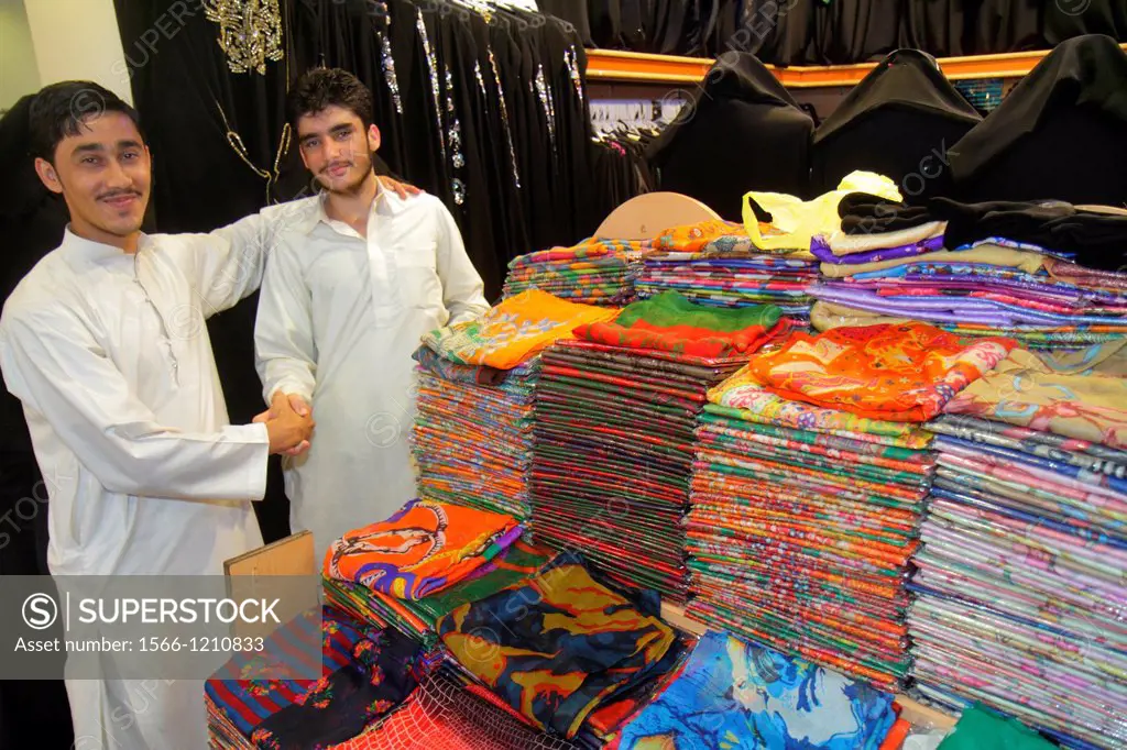 United Arab Emirates, U A E , UAE, Middle East, Dubai, Deira, Murshid Bazar, bazaar, shopping, clothing, store, for sale, Asian, man, migrant worker, ...