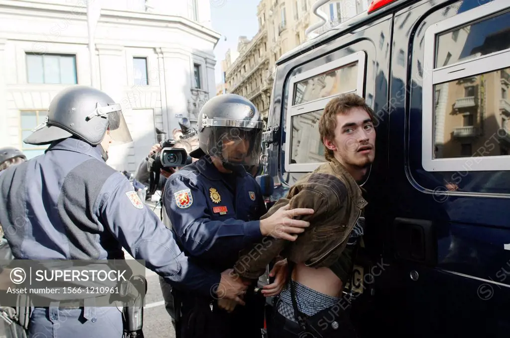 Riot police detain a protester during a general strike on November 14, 2012 in Madrid, Spain