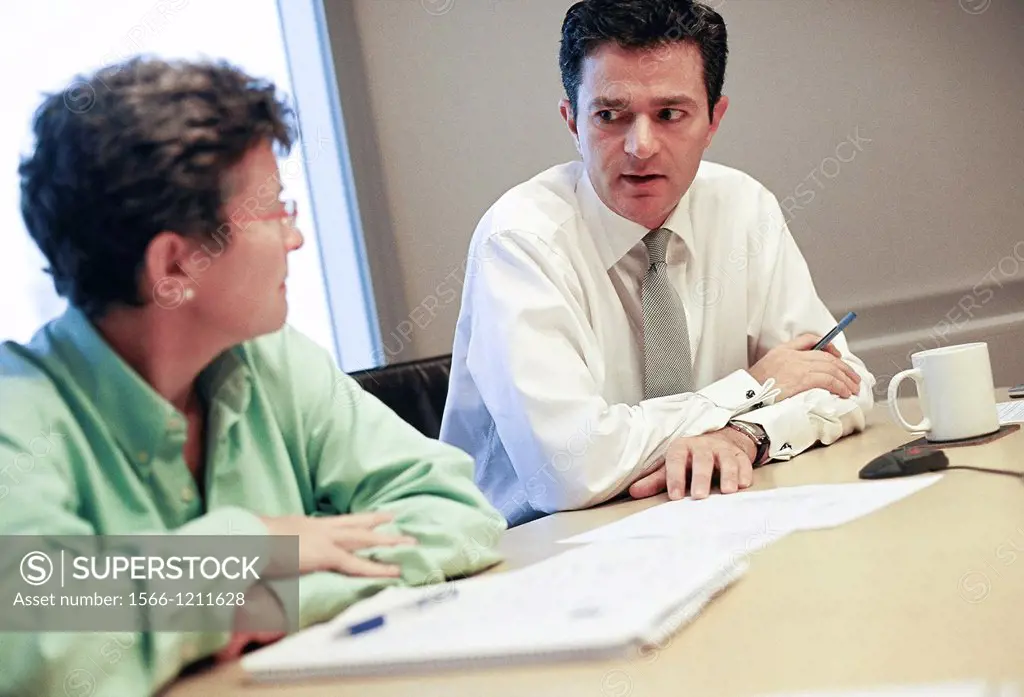 Workers in the office of Credit Suisse First Boston CSFB, a leading stockbroker and investment bank