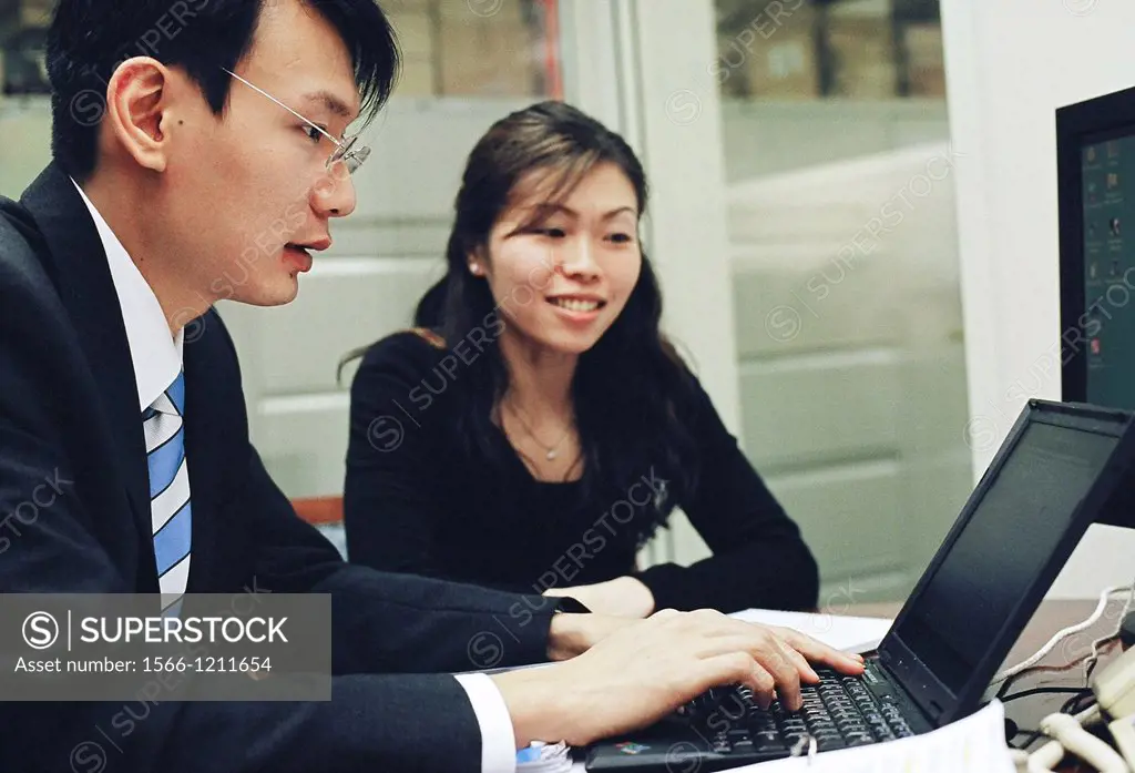 Workers in the office of Credit Suisse First Boston CSFB, a leading stockbroker and investment bank