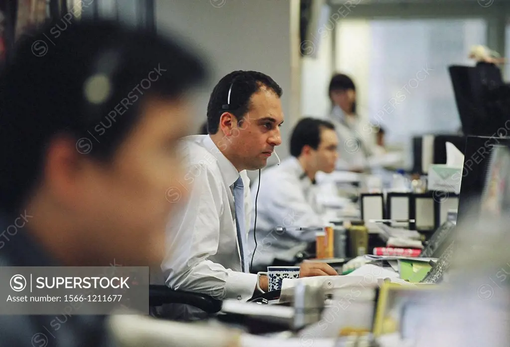 Workers in the office of Credit Suisse First Boston CSFB, a leading stockbroker and investment bank