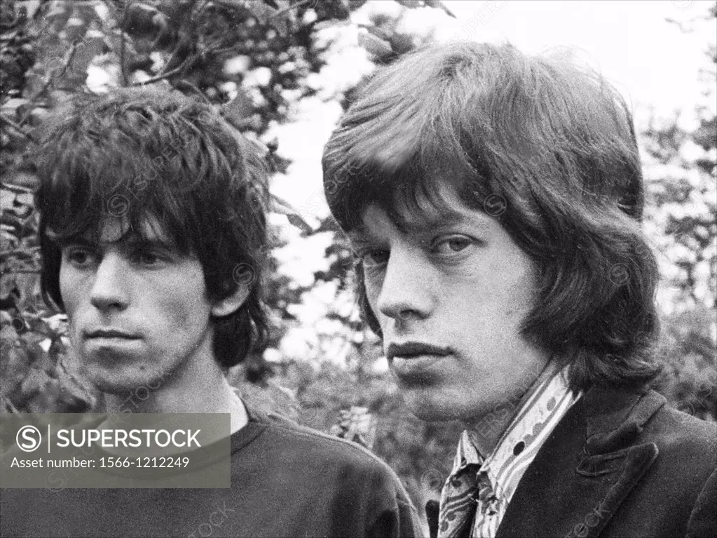 Keith Richards and Mick Jagger exclusive image from 1967 by David Cole in the gardens at Redlands, Richards´ Sussex home, at the time of the police dr...