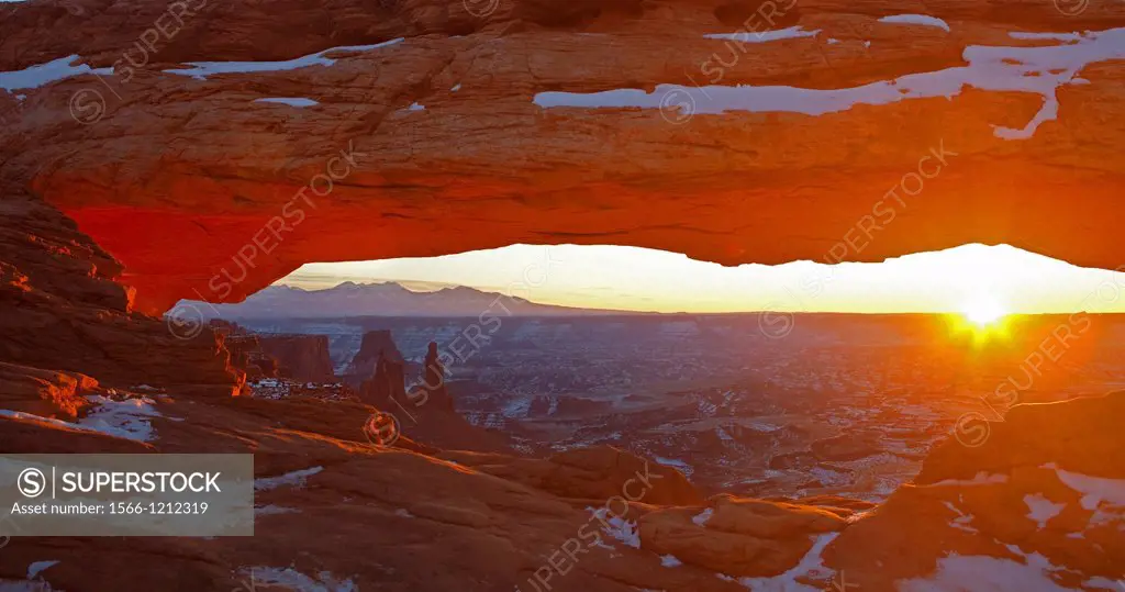 Sunrise and sunbeam at Mesa Arch, Canyonlands National Park, USA