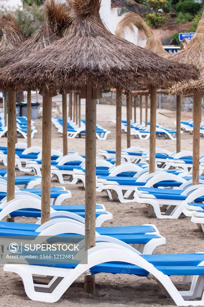 Umbrellas and deckchairs, Majorca, Balearic Islands, Spain.