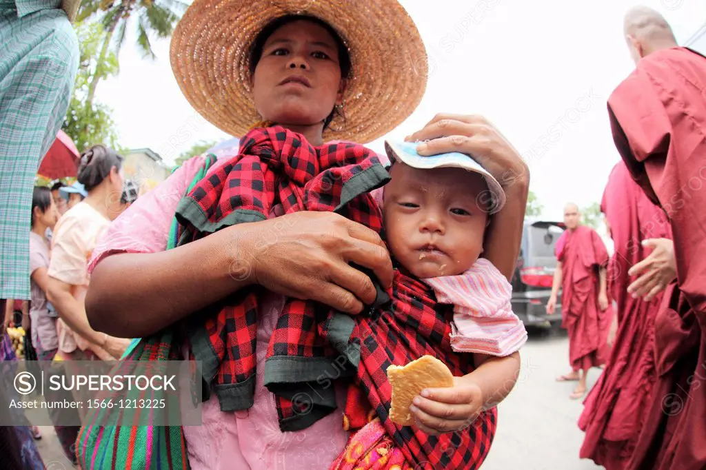 Pa-O woman carrying her boy at Local Market, Inle Lake, Shan State, Myanmar