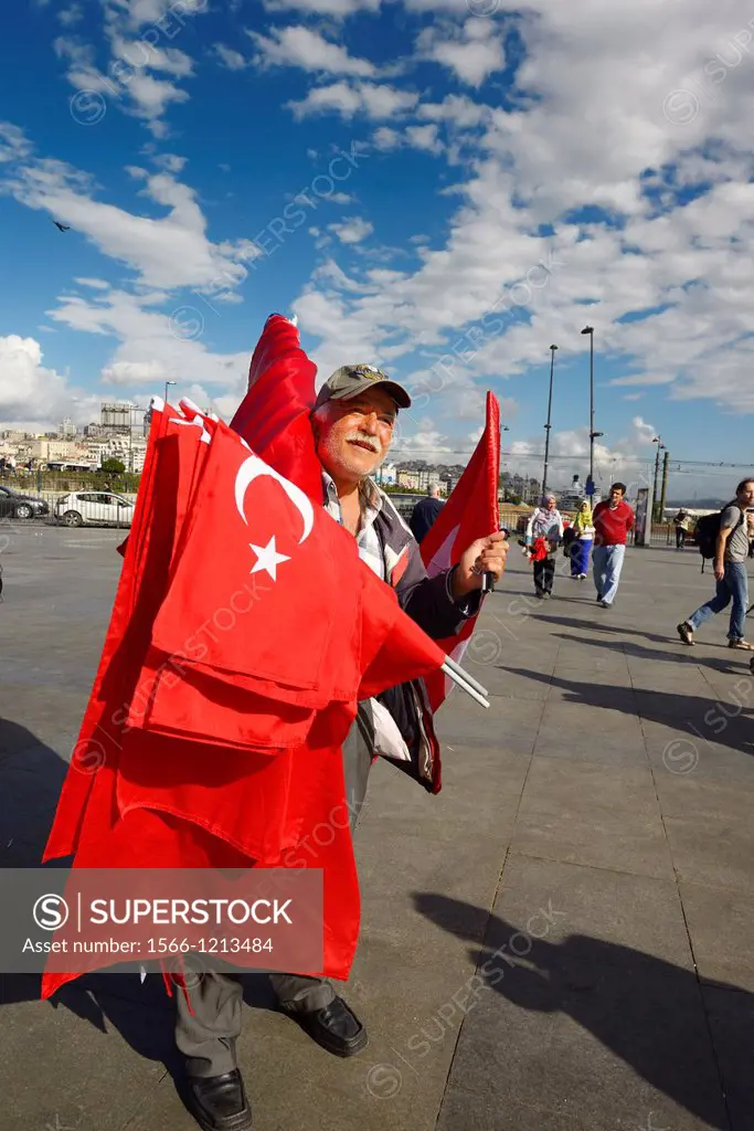 Turkish flag seller in the square between Yeni Camii New Mosque and Egyptian Spice Bazaar Istanbul