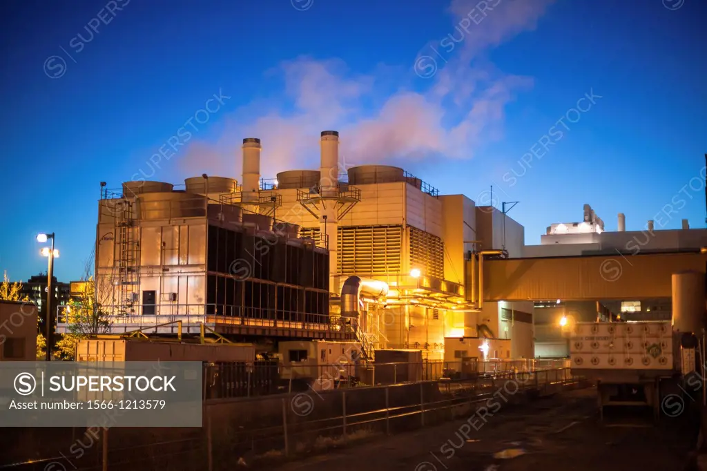 Industiral cooling plant at dawn with blue sky