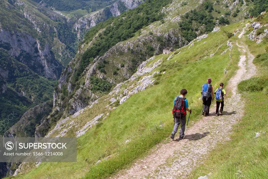 Hikers walking up to Tresviso, a small village in Picos de Europa National Park by historic Urdón path from La Hermida Gorges  Peñarrubia  Cantabria, ...
