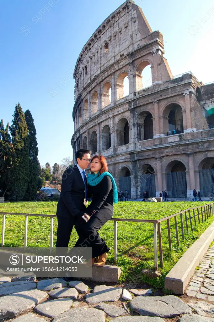 Couple in front of the Roman Colosseum Rome Italy