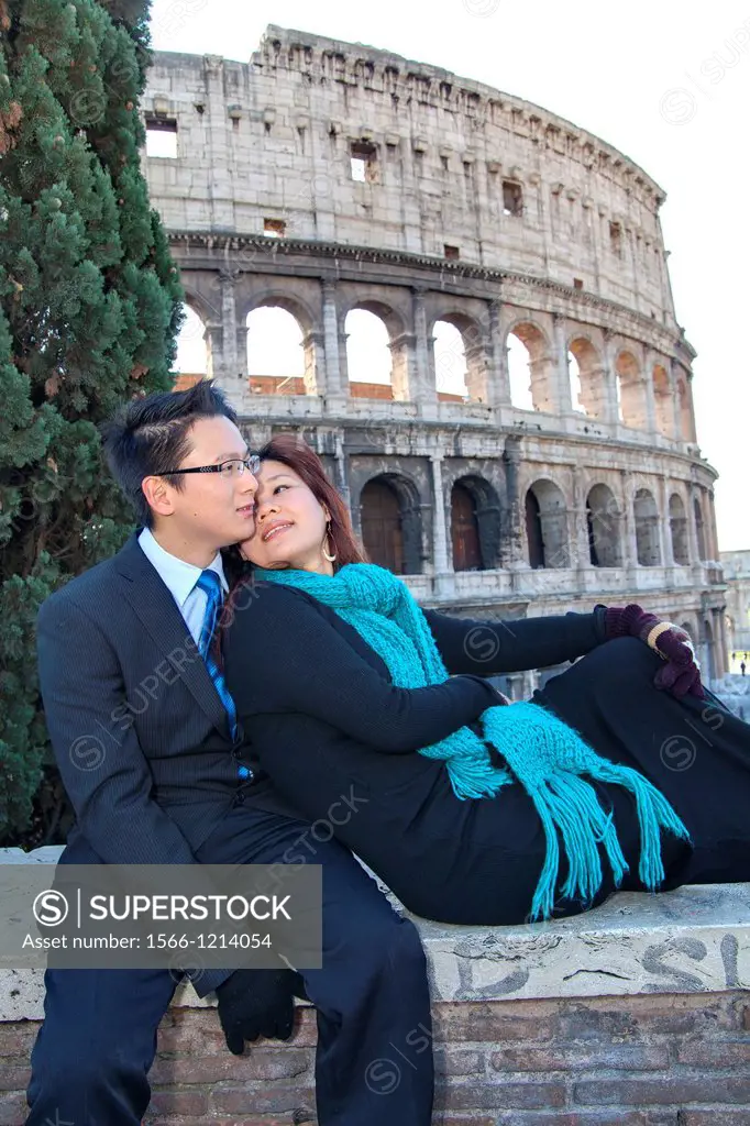 Couple in front of the Roman Colosseum Rome Italy