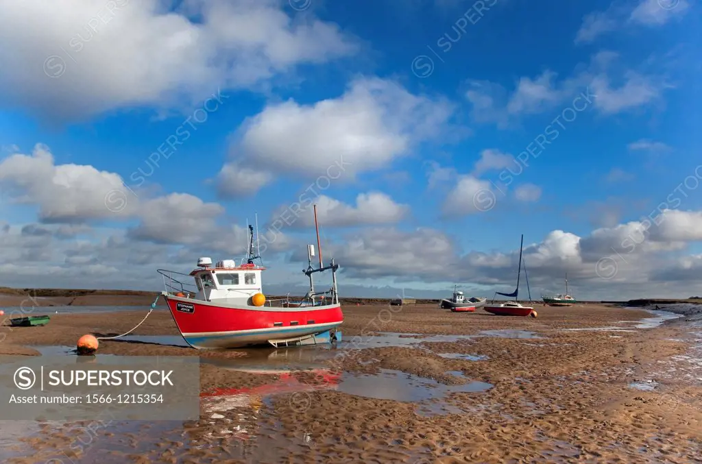 Wells Harbour & fishing boat low tide Norfolk