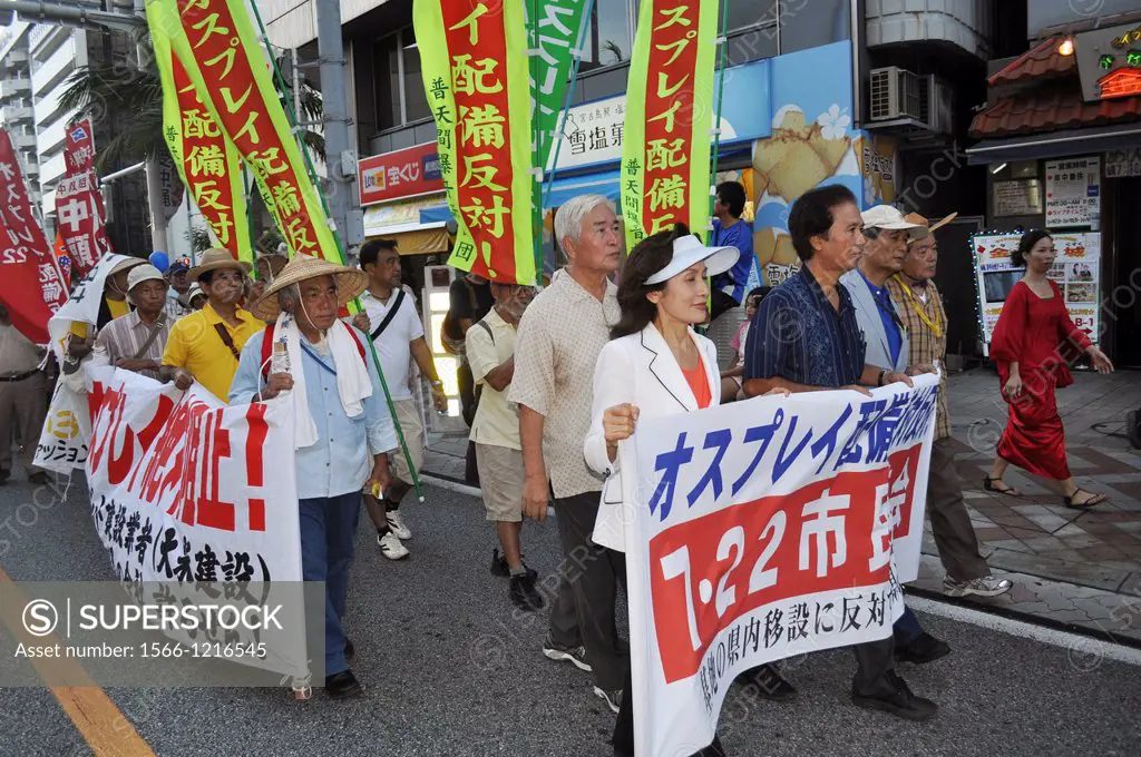 Naha, Okinawa, Japan, people along Kokusai-dori protesting against the American military occupation of Okinawa, the use of V-22 Osprey helicopters and...