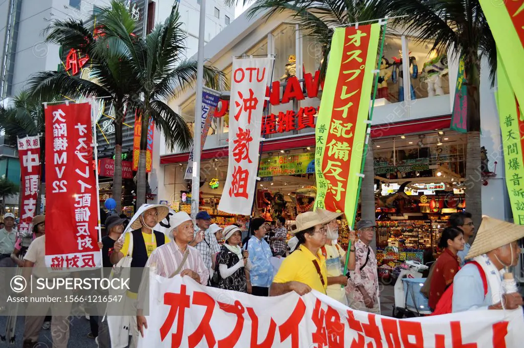 Naha, Okinawa, Japan, people along Kokusai-dori protesting against the American military occupation of Okinawa, the use of V-22 Osprey helicopters and...