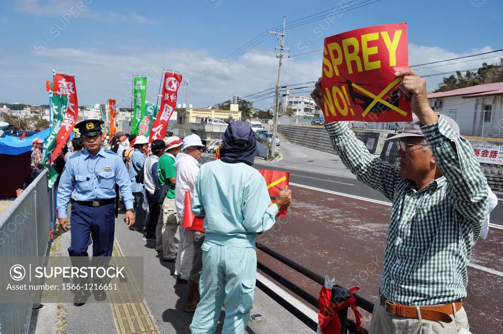 Ginowan, Okinawa, Japan, people protesting outside Futenma base against the American military occupation of Okinawa and the use of V-22 Osprey helicop...