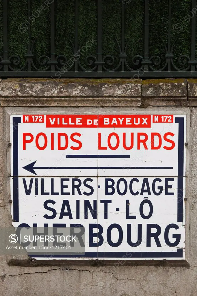 France, Normandy Region, Calvados Department, Bayeux, vintage tiled road sign