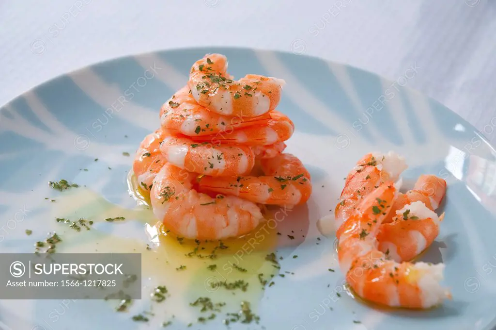 Piled prawns with olive oil and parsley. Spain.