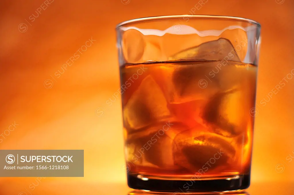 An orange colored back-lite adult beverage