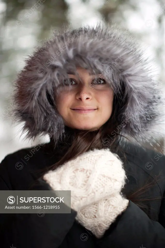 20-something, olive skinned, long hair girl outside in winter