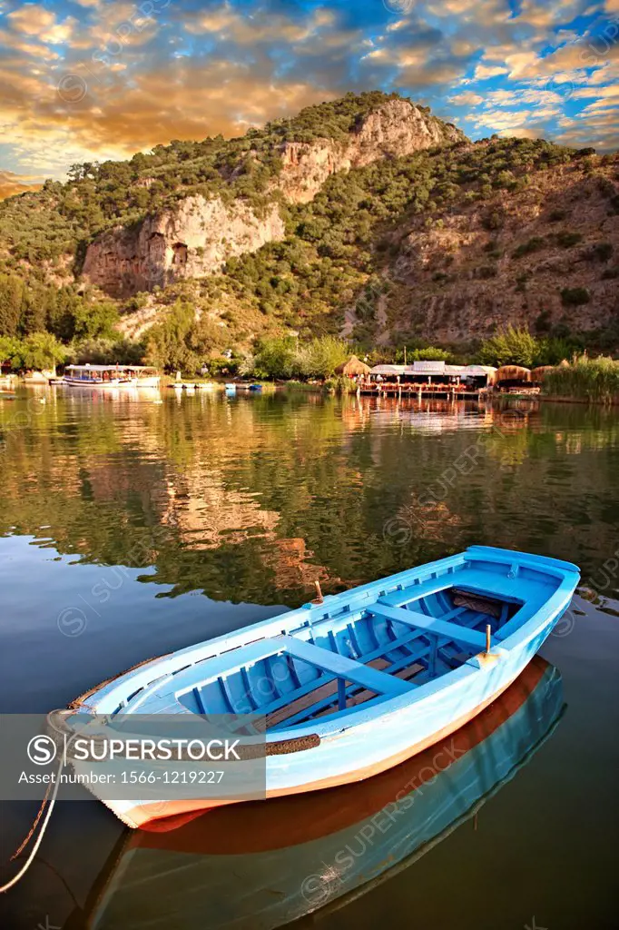 Ferry row boat on the Dalyan Çay River looking towards boats & fish restaurant  Mediterranean coast Turkey