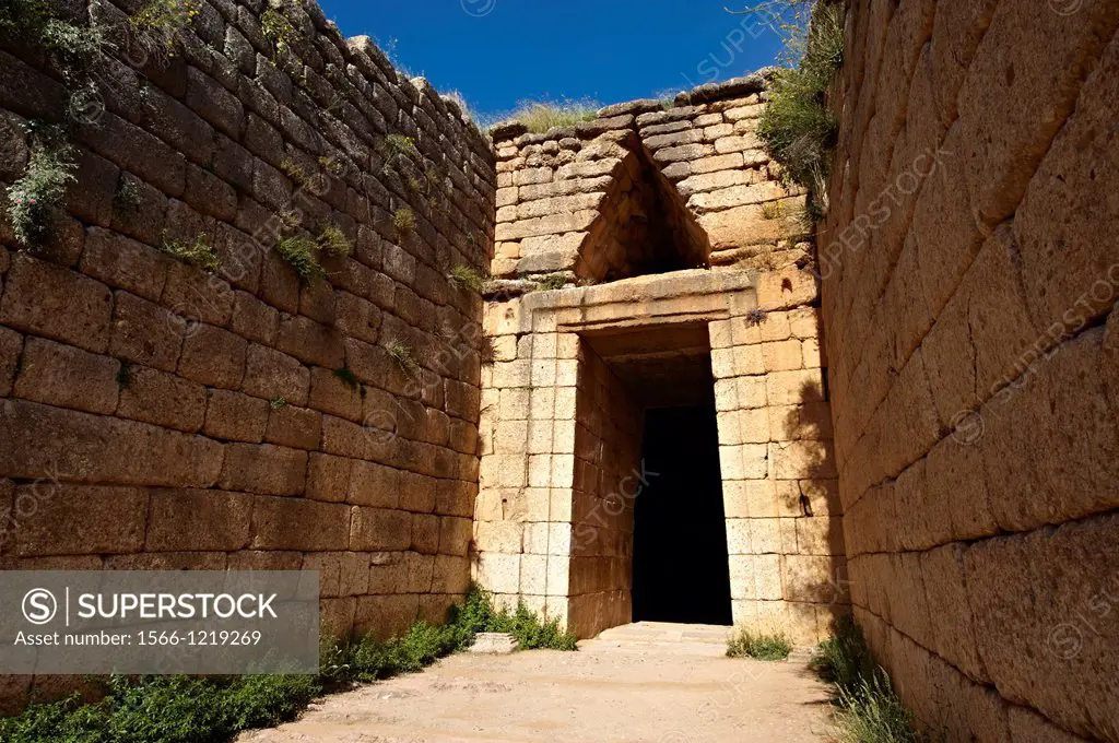Entrance to the Treasury of Atreus is an impressive ´tholos´ beehive shaped tomb on the Panagitsa Hill at Mycenae  The entrance has the typical square...