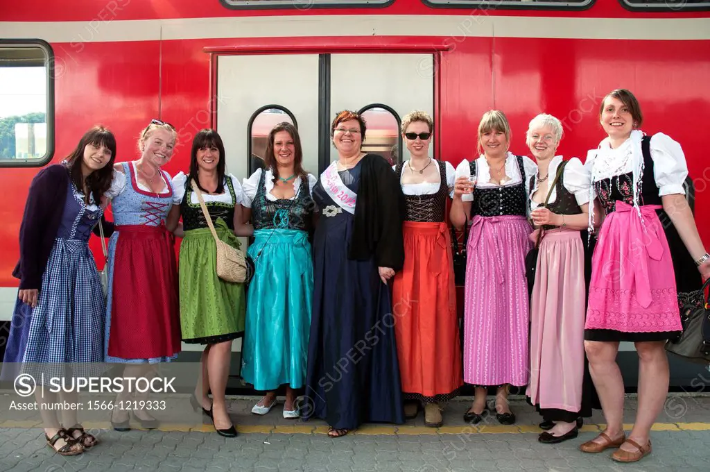 Young women wearing traditional Bavarian costume, returning home from a pre-wedding or ´hens´ party´
