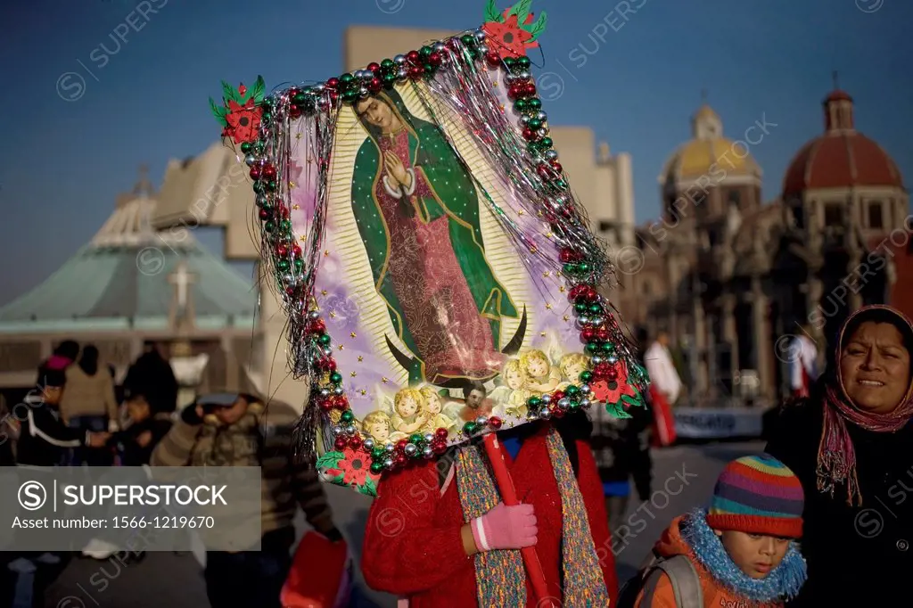 A pilgrim carries an image of the Our Lady of Guadalupe outside of the Our Lady of Guadalupe Basilica in Mexico City, December 9, 2012