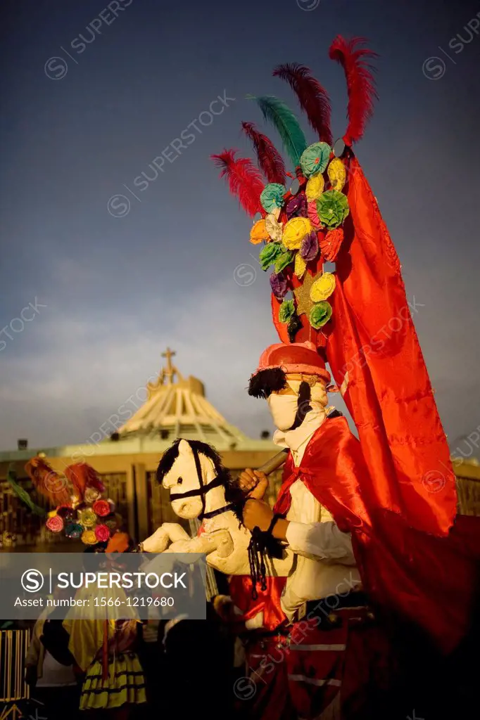 A pilgrim from Tomatlan, Veracruz state, dressed as Saint James apostle performs the Baile de los Santiagos or Saint James´s Dance riding a toy horse ...