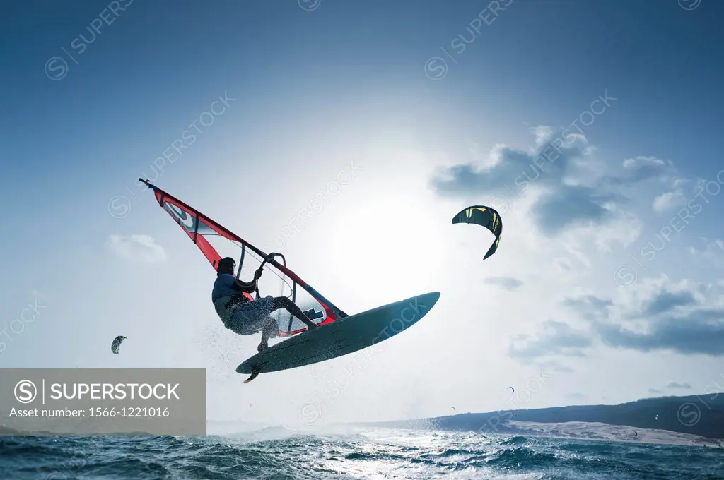Windsurfer jumping. Tarifa, Costa de la Luz, Cadiz, Andalusia, Spain, Europe.