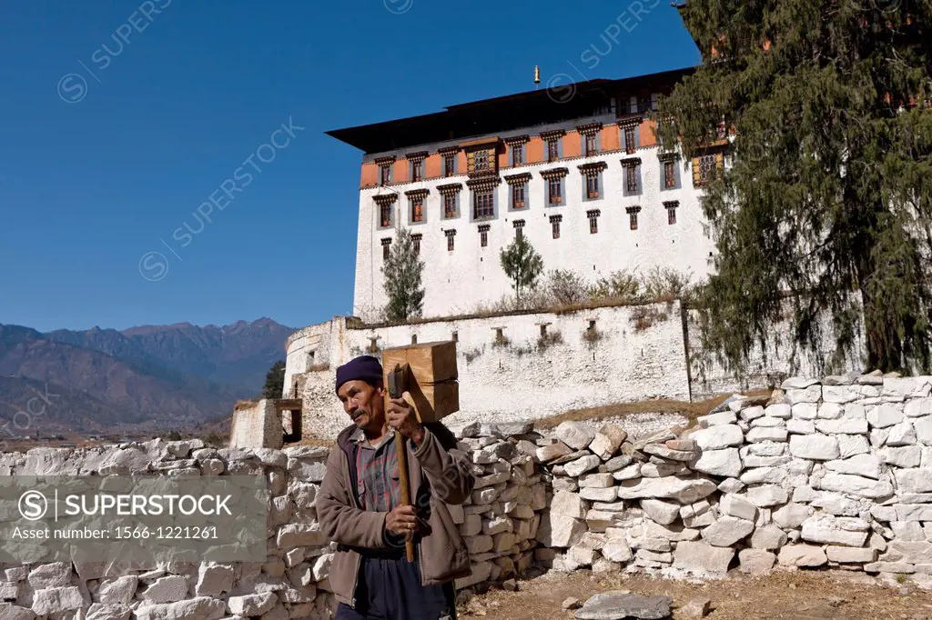 Villager outside Ta Dzong, Paro, Bhutan, Asia.