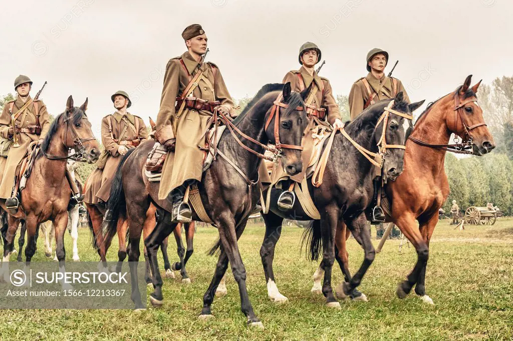 Polish cavalrymen ride their horses during WWII Battle of Lomianki - historical reenactment, Poland