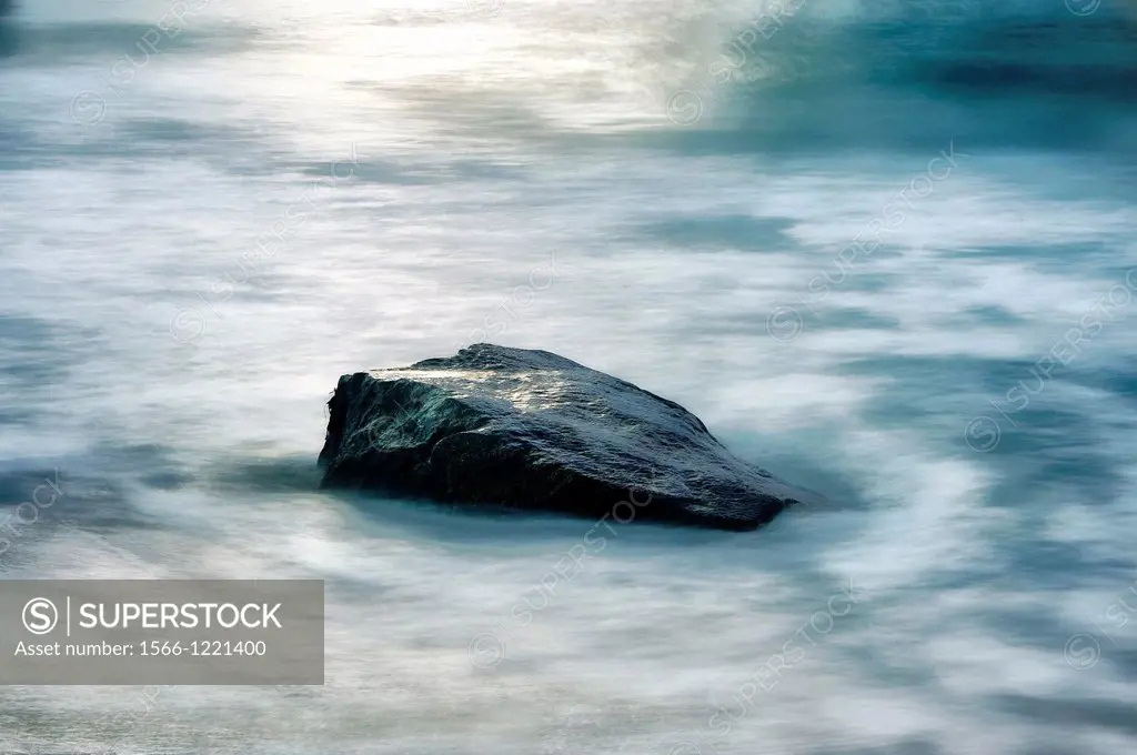 Rock with moving ocean water