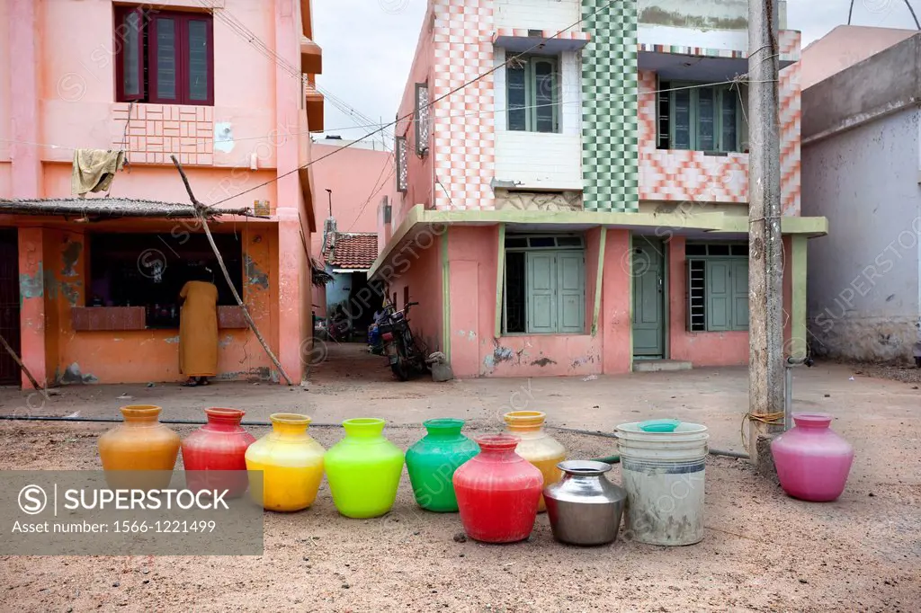 Kanyakumari, India-September 9, 2012  several jugs placed in a row, keep the order in which they will be filled with water in the town, as there is no...