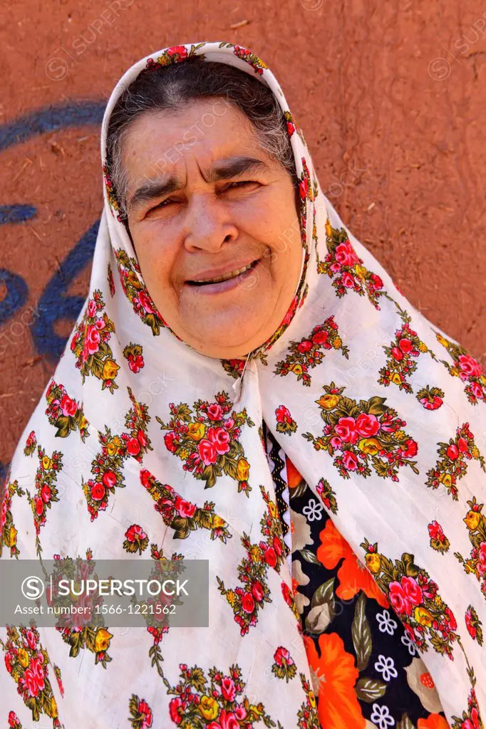 Portrait of a iranian woman wearing traditional floreal chador, Abyaneh, Iran