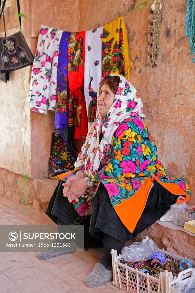 Woman wearing traditional floreal chador, Abyaneh, Iran