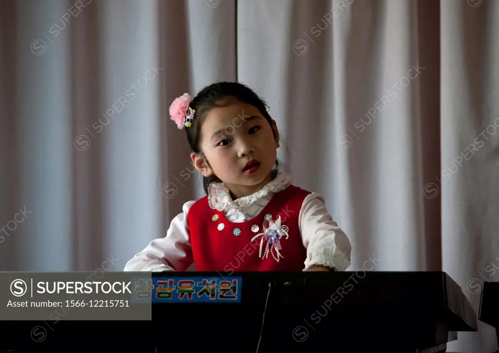Young Girl Playing Piano In Kwangbok School, Pyongyang, North Korea
