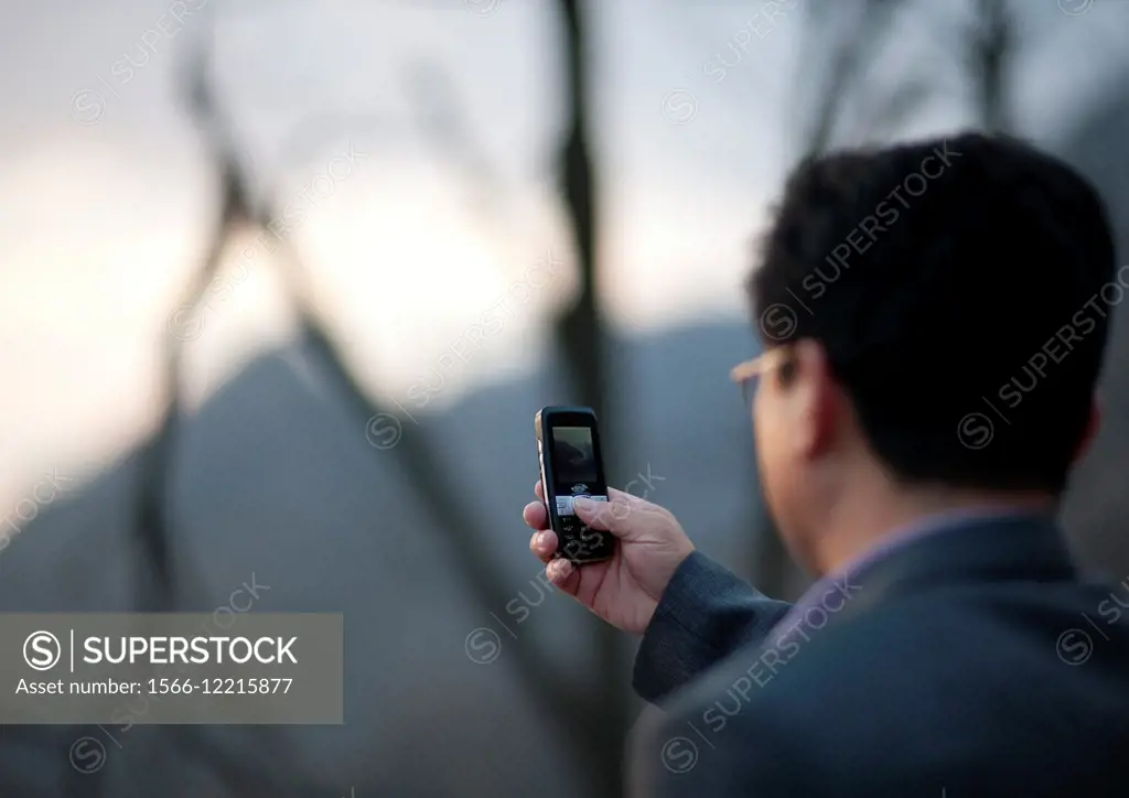 North Korean Taking Pictures With His Mobile, Pyongyang, North Korea.