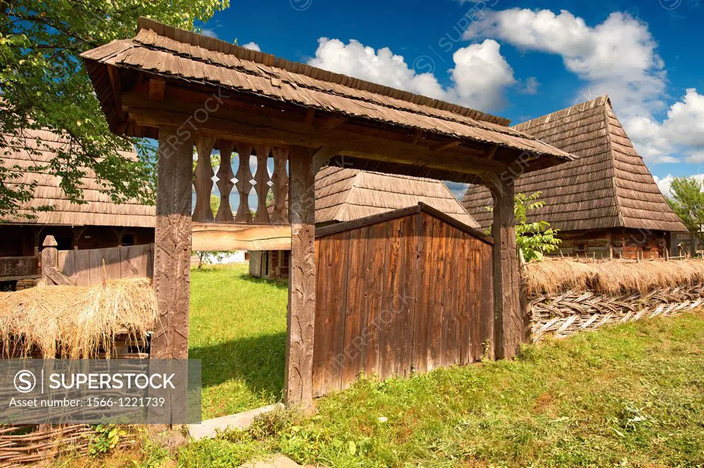 19th century traditional farm house & wicker corn store of the Iza Valley, The Village museum near Sighlet, Maramures, Northern Transylvania