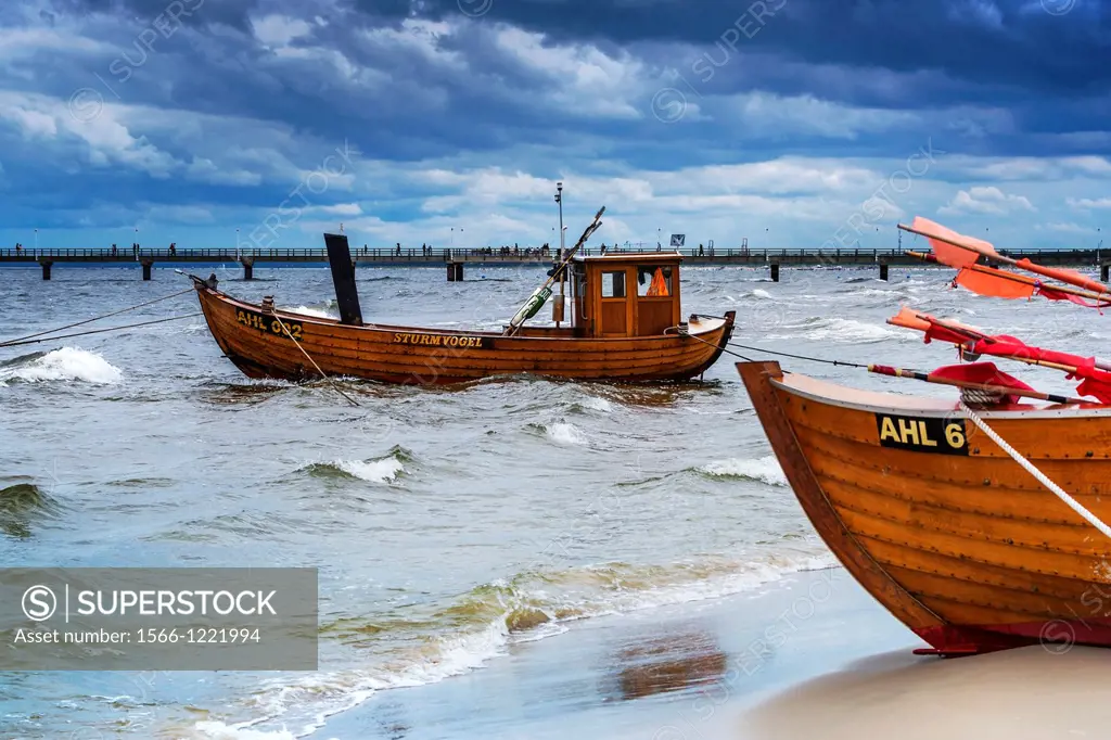 Two Fishing boats at the beach of the Baltic Sea, near the pier of the Baltic Sea resort of Ahlbeck, Municipality of Heringsdorf, Usedom Island, Count...
