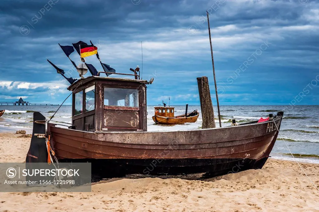 Two Fishing boats at the beach of the Baltic Sea, near the pier of the Baltic Sea resort of Ahlbeck, Municipality of Heringsdorf, Usedom Island, Count...