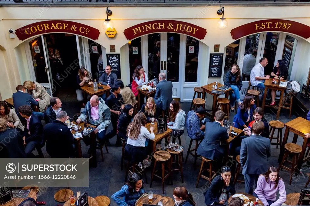 People Eating and Drinking Outside The Punch & judy Pub, Covent Garden, London, England.