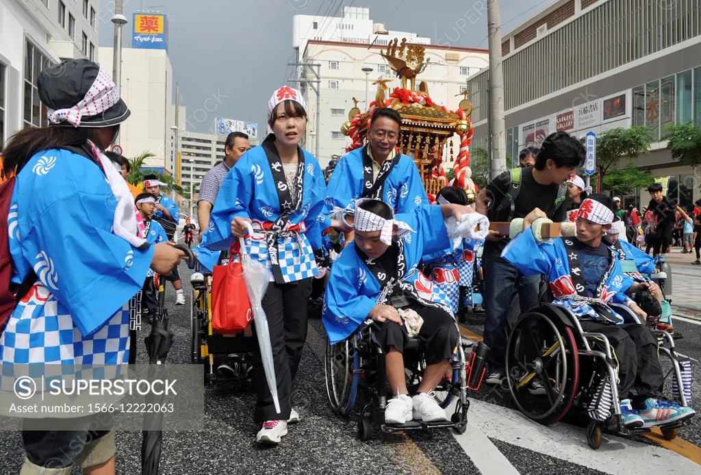 Naha, Okinawa, Japan: disabled persons on parade during the Naha Festival, along Kokusai-dori in October