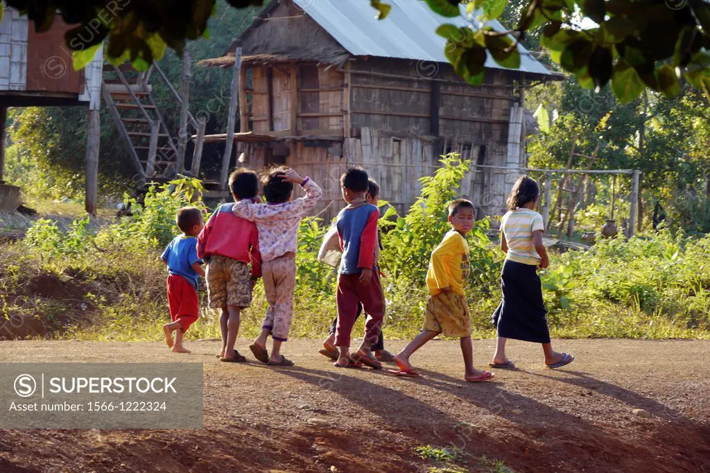 CAMBODIA. Projects of Caritas Cambodia, funded by SCIAF. Putil village. Children walking