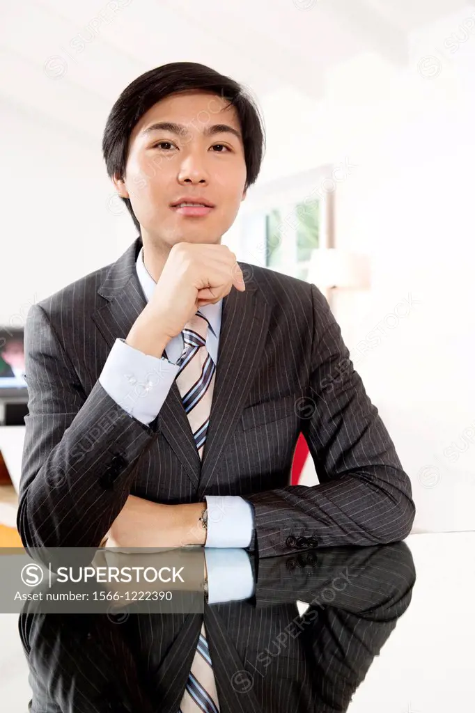 Expressive young Asian businessman