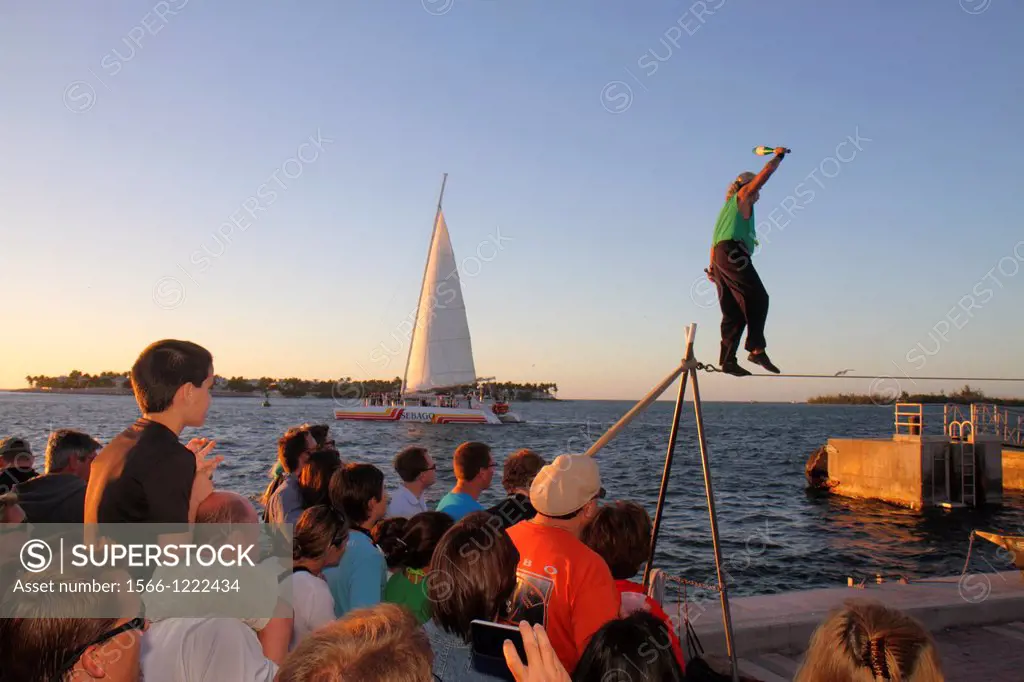 Florida, Florida Keys, Key West, Gulf of Mexico, water, Mallory Square, Sunset Celebration, performer, man, audience, watching, tightrope, high wire, ...