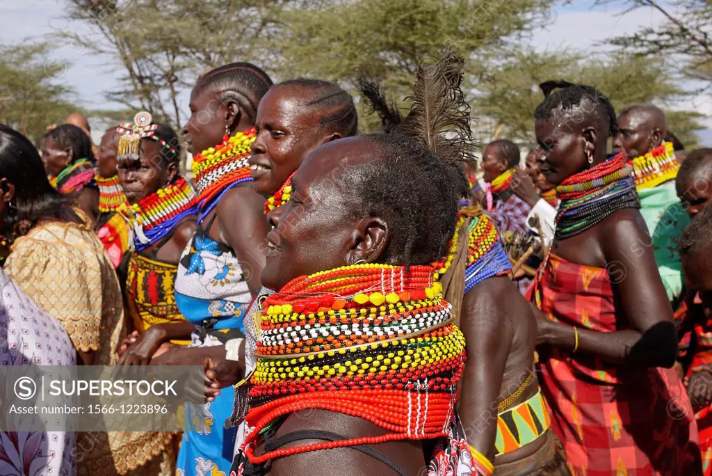 Kenya. Turkana tribespeople dancing at the event of a confirmation ceremony in Lorugumu, Turkana.