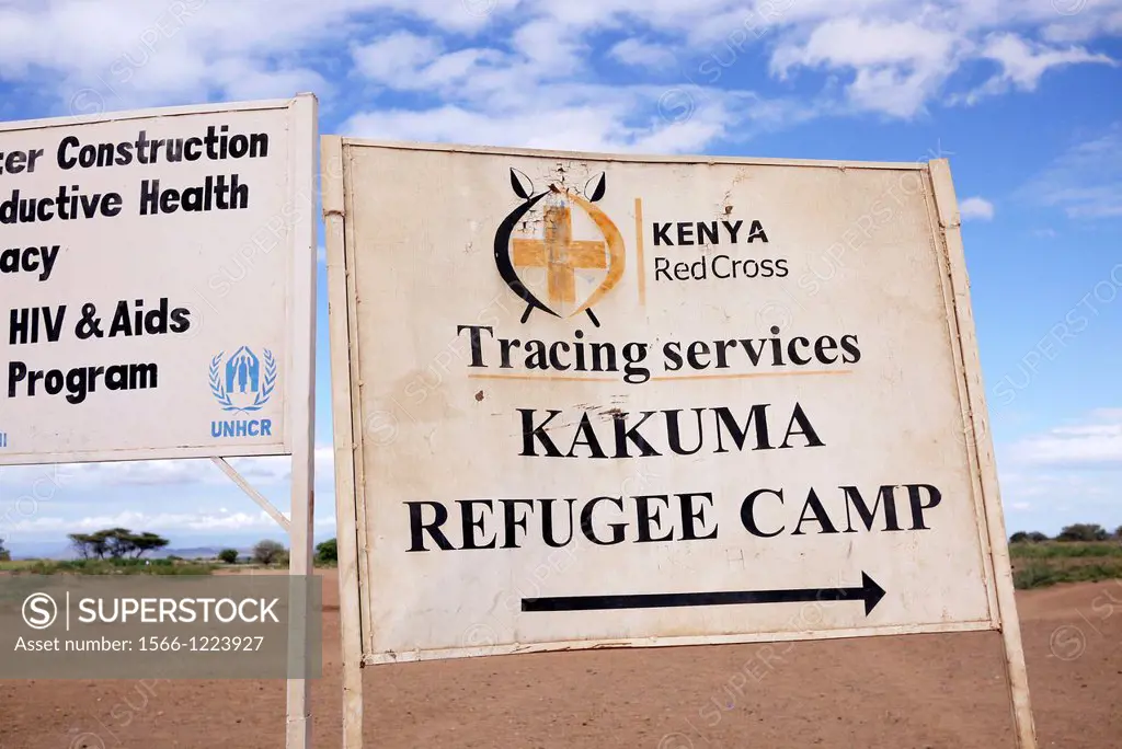 Kenya. Signs for various NGOs on the road outside the refugee camp at Kakuma, Turkana.
